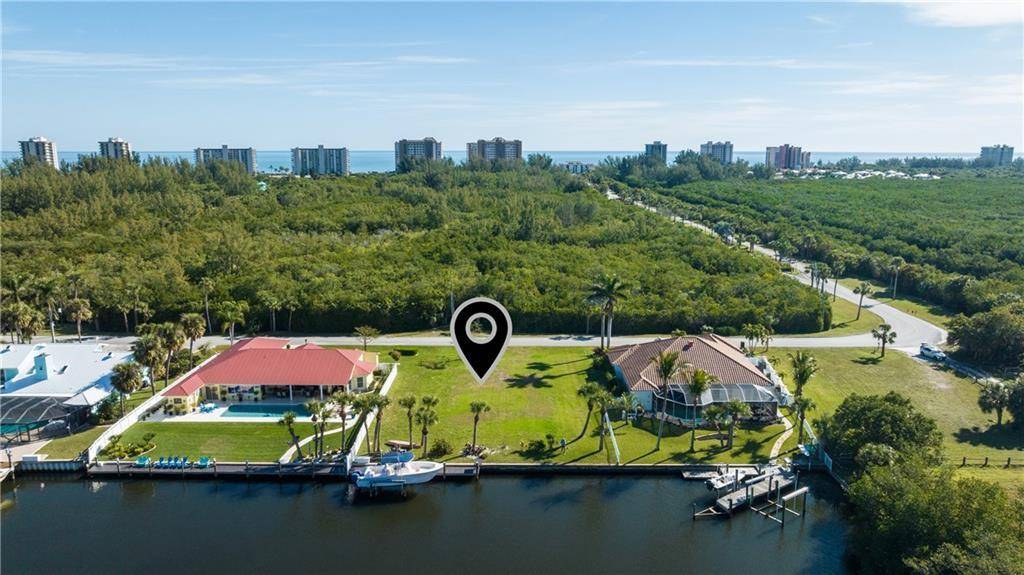 Rare opportunity to own a high elevation, oversized lot 100' x 160' in Queens Cove, a premier waterfront gated community on Florida's Treasure Coast.