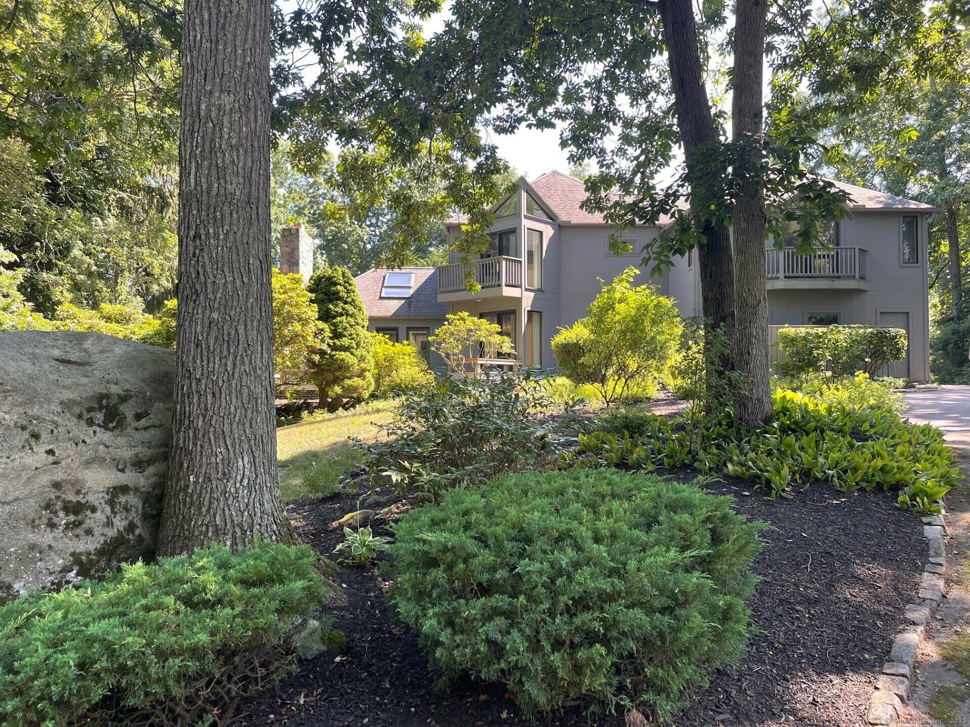 Nestled in the tranquil and coastal enclave of Mason's Island, this stunning residence sits amid tall pines and winding streets just moments from the heart of downtown Mystic.