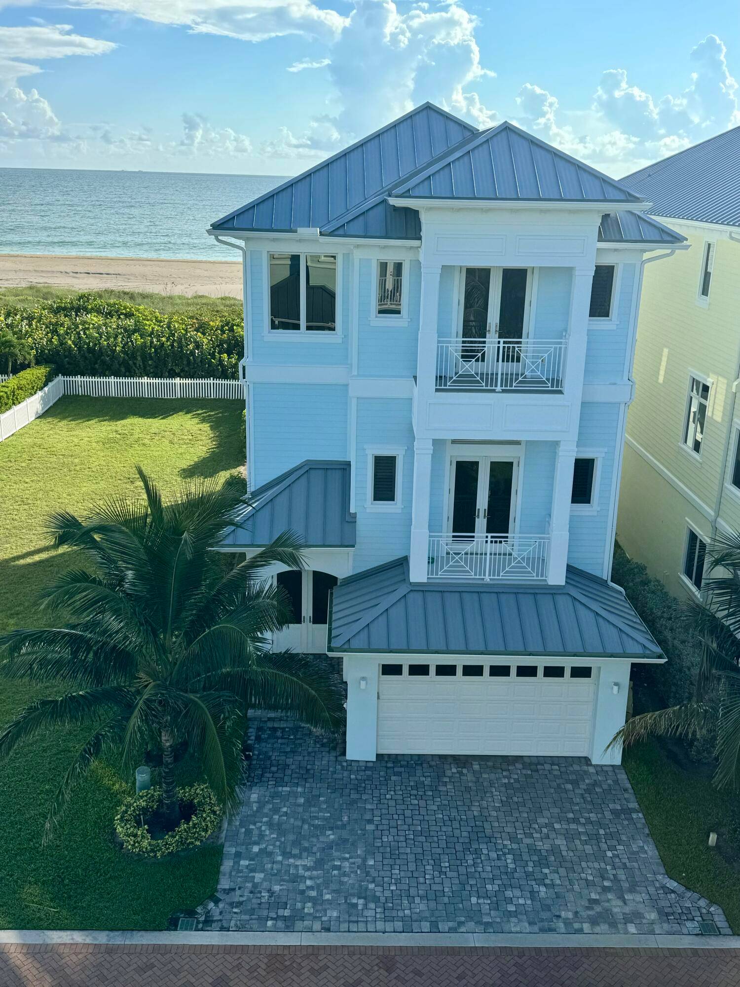 OCEANFRONT ESTATE 5 5. 5 3 VACAND and AVAILABLE for immediate close 3 stories nestled between the Atlantic Ocean and the Indian River in a GATED COMMUNITY in S.