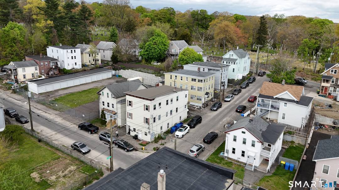Welcome to 38 Green Street in Waterbury a fantastic investment opportunity featuring a rare two building parcel with a total of six residential units.