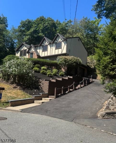 Discover this beautifully updated bi level Tudor style home, nestled in a sought after suburban like community.