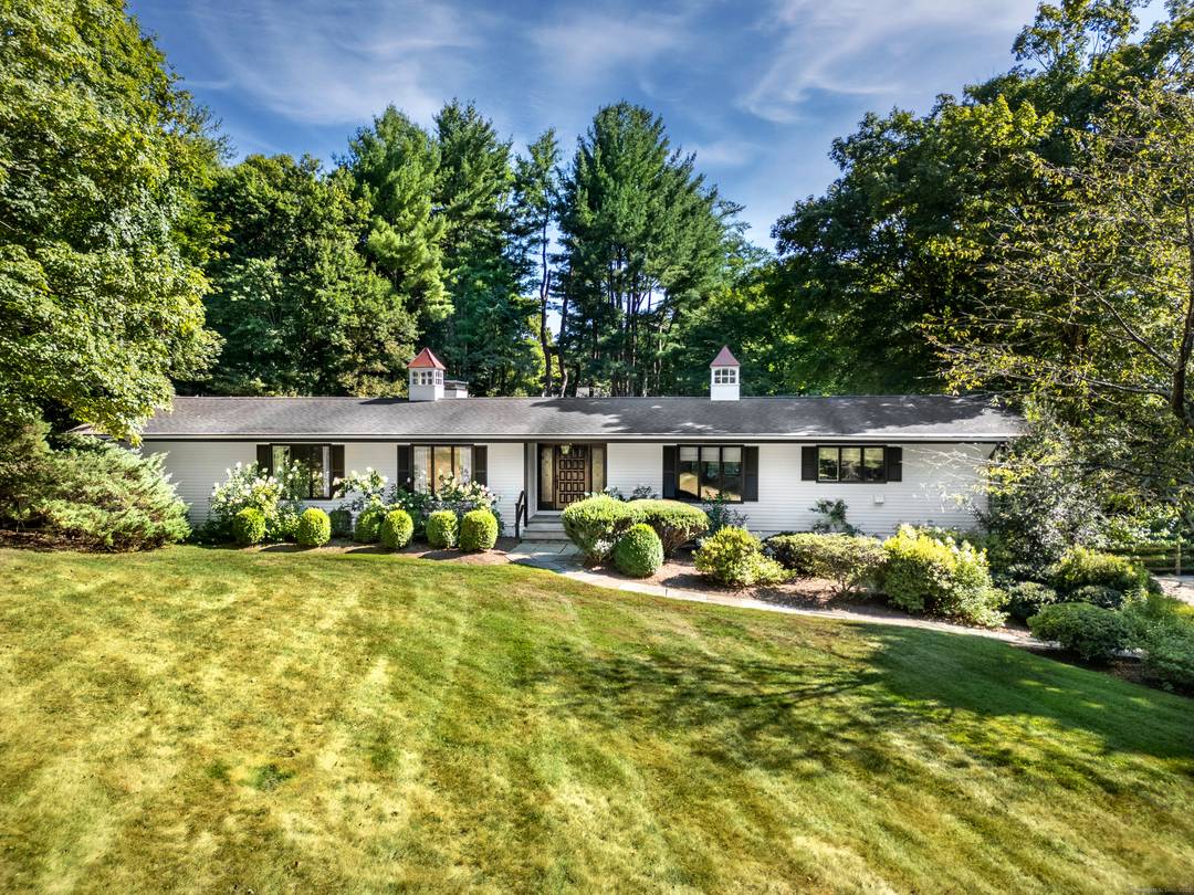 Situated on 2 manicured acres in Southport and surrounded by multi million dollar estates, this gated, European inspired country home blends timeless charm with modern elegance.