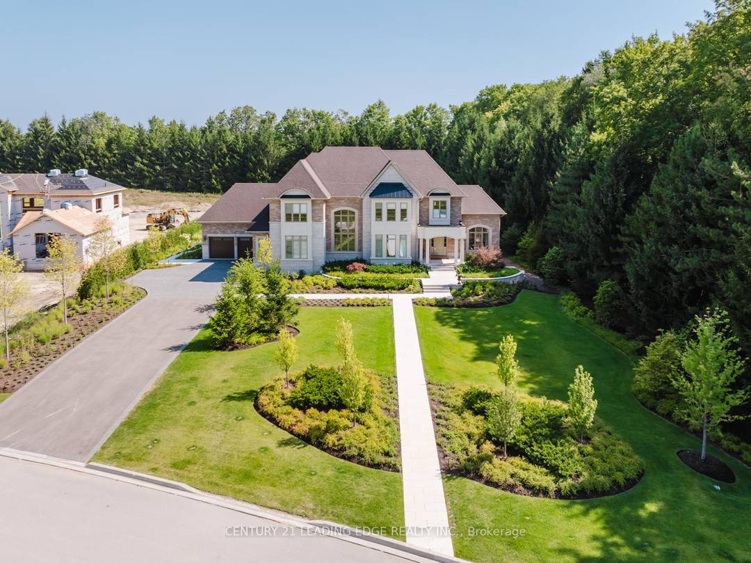 Set on nearly 1. 5 acres and enveloped by untouched forest, this remarkable estate boasts more than 8, 000 square feet of finished living space, including a walk up basement, ...
