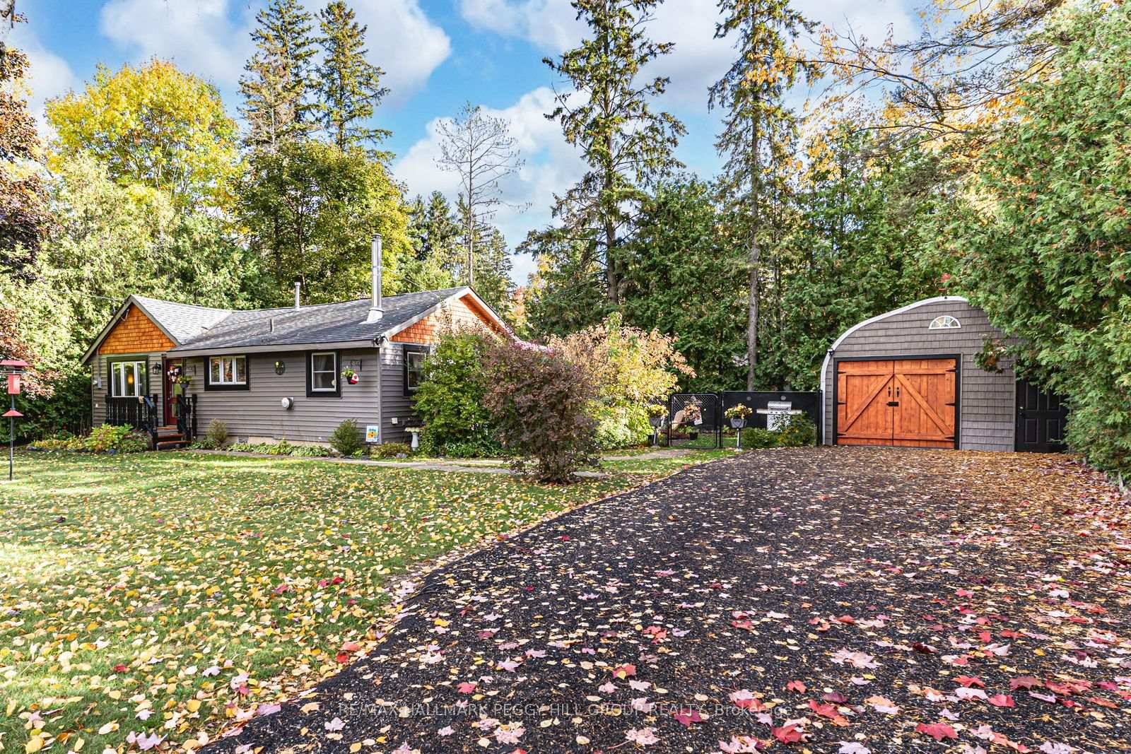 EXTENSIVELY UPDATED BUNGALOW WITH A CUSTOM DETACHED GARAGE, GENEROUSLY SIZED LANDSCAPED LOT amp ; STEPS TO THE BEACH !