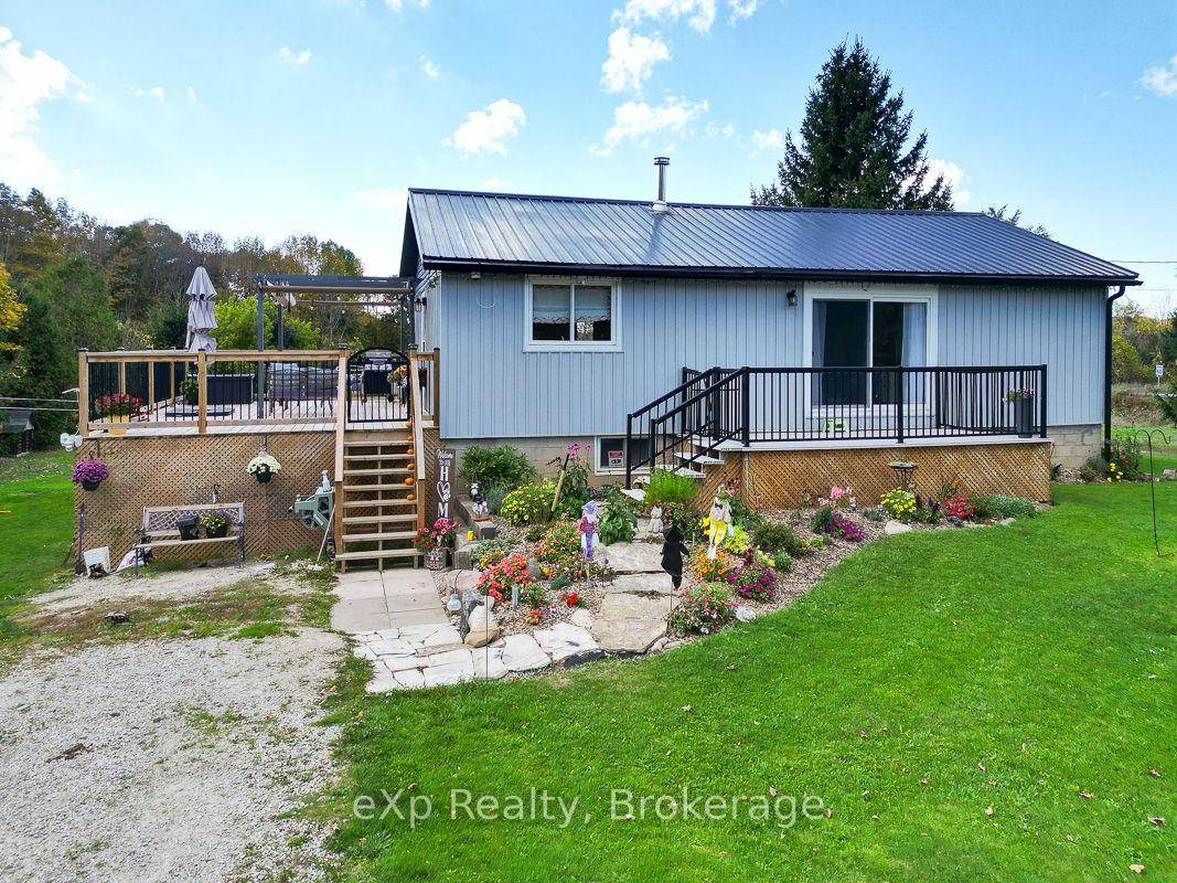 Set on 65 acres, this property offers a great mix of open land and forest about 20 acres of workable ground plus trails through maple, birch, cedar, and elm trees.