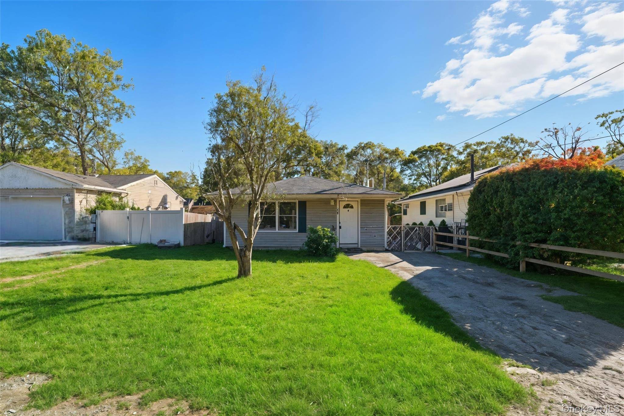 Welcome to this beautifully renovated ranch in the heart of Mastic !