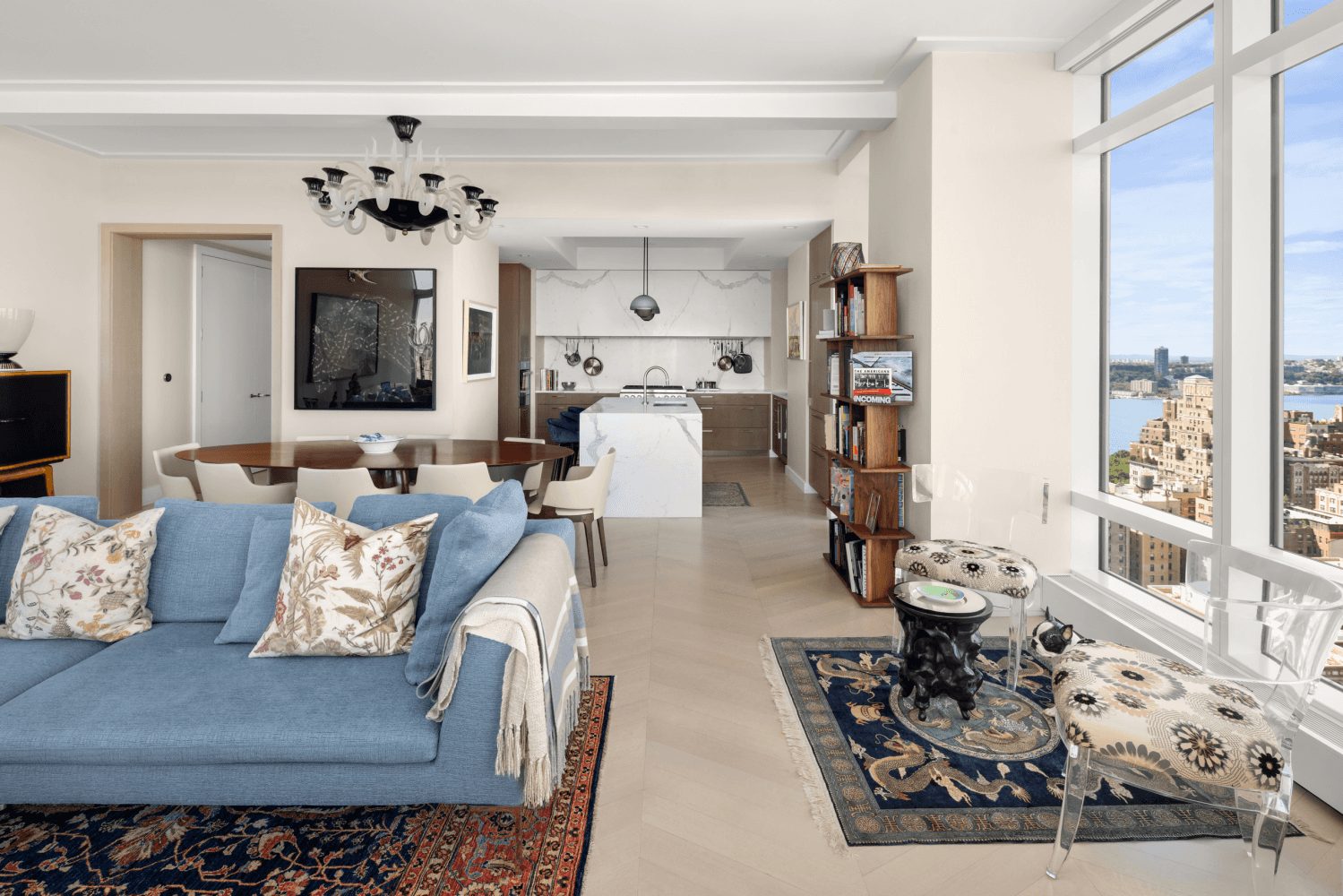 This triple mint 2, 092 square foot residence blends the grandeur of a pre war loft with the light and views of a modern tower.