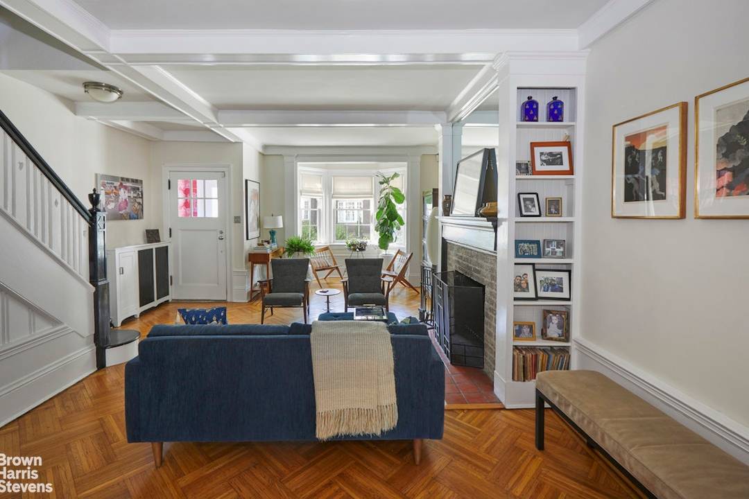 2119 Albemarle Terrace is a distinguished neo Federal style single family townhouse set on one of the two quiet cul de sacs that form the Albemarle Kenmore Terrace Historic District.