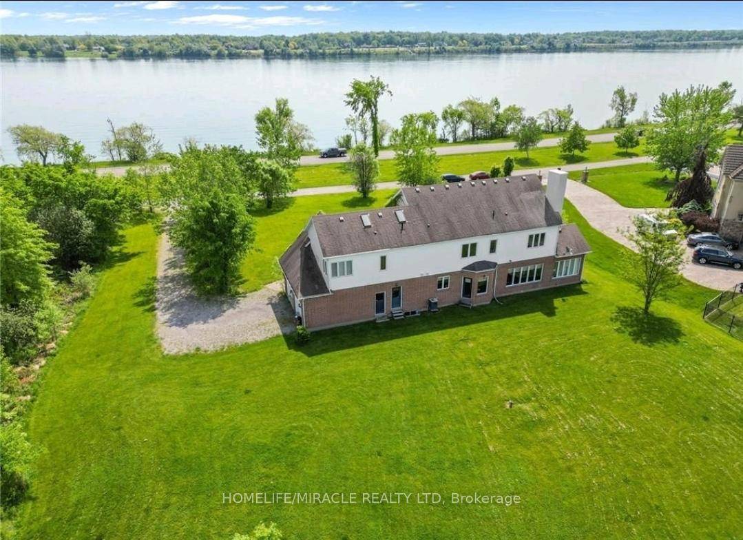 Exquisite 4 Bedroom Waterfront Retreat in Lyons Creek Community stunning 3, 500 sq.