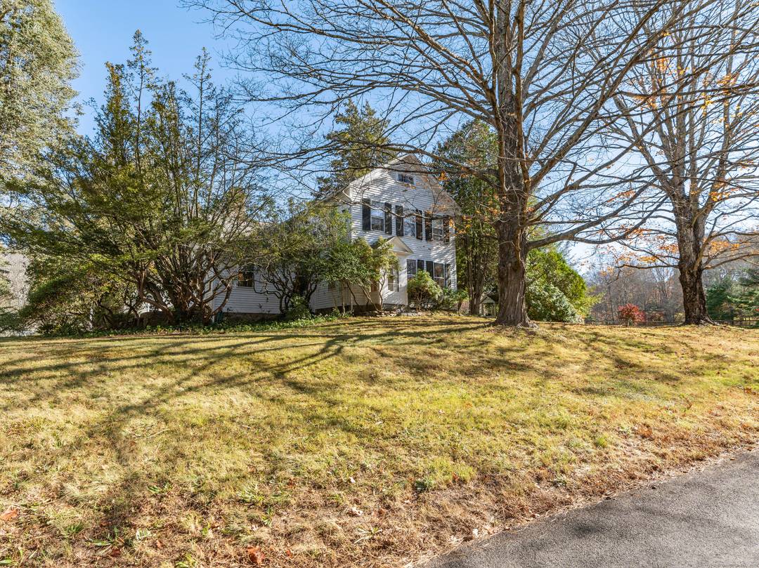 Nestled along one of Lyme's most picturesque country roads, this timeless 1840 residence sits gracefully on 11 private acres of meadows, stone walls, fences and mature plantings.
