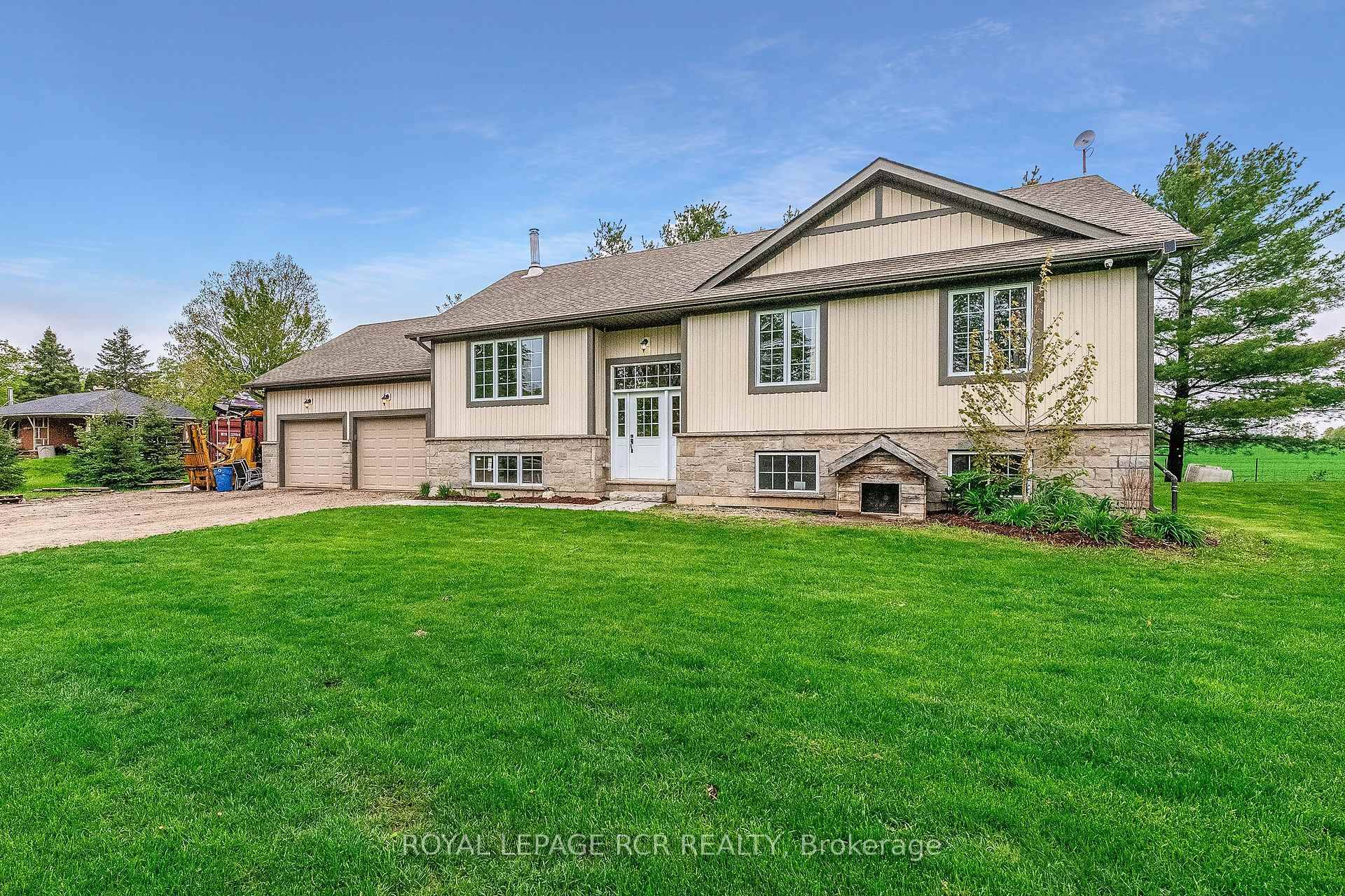 Escape the hustle and bustle of the city and enjoy the peace and privacy of country living in this beautifully maintained, custom built raised bungalow.