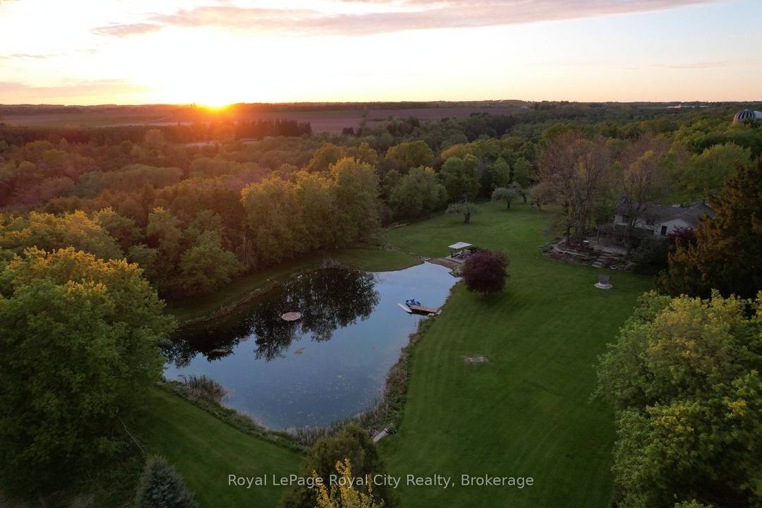 98 breathtaking acres in the heart of Elora's countryside and backing on The Grand River !
