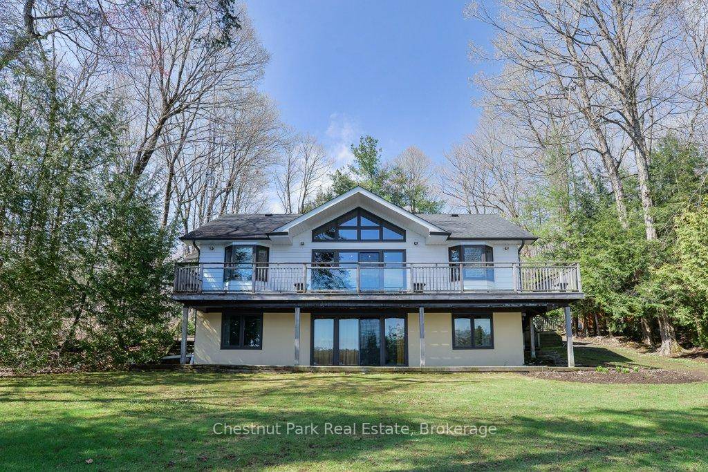 Set on the coveted shores of Lake Muskoka in sought after Sunset Bay, this inviting four bedroom, 2.