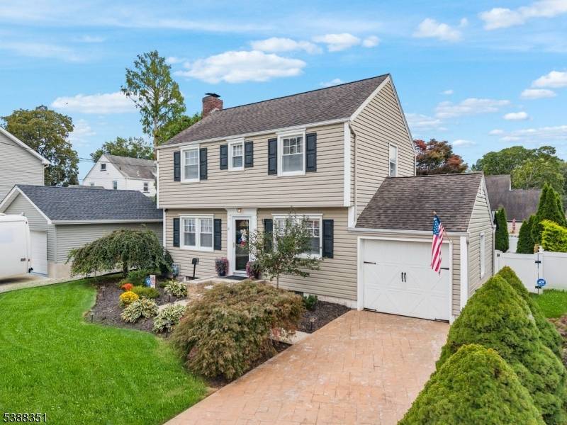 Discover this beautifully updated Center Hall Colonial in Clifton's desirable Allwood section, offering the perfect balance of charm and modern comfort.