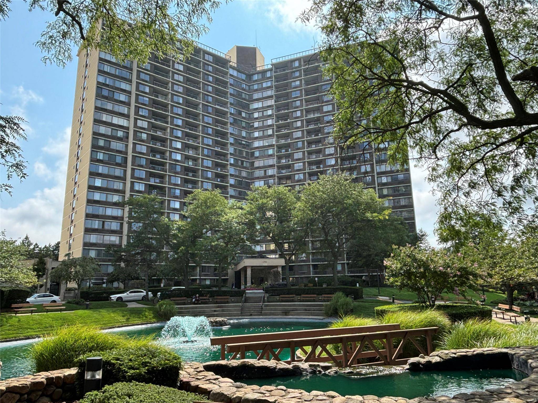 Luxury high rise Bay Club gated community condominium, 24 hour security, building doorman, concierge, Large, bright 1 BR with water views from the terrace, wooden floors throughout.