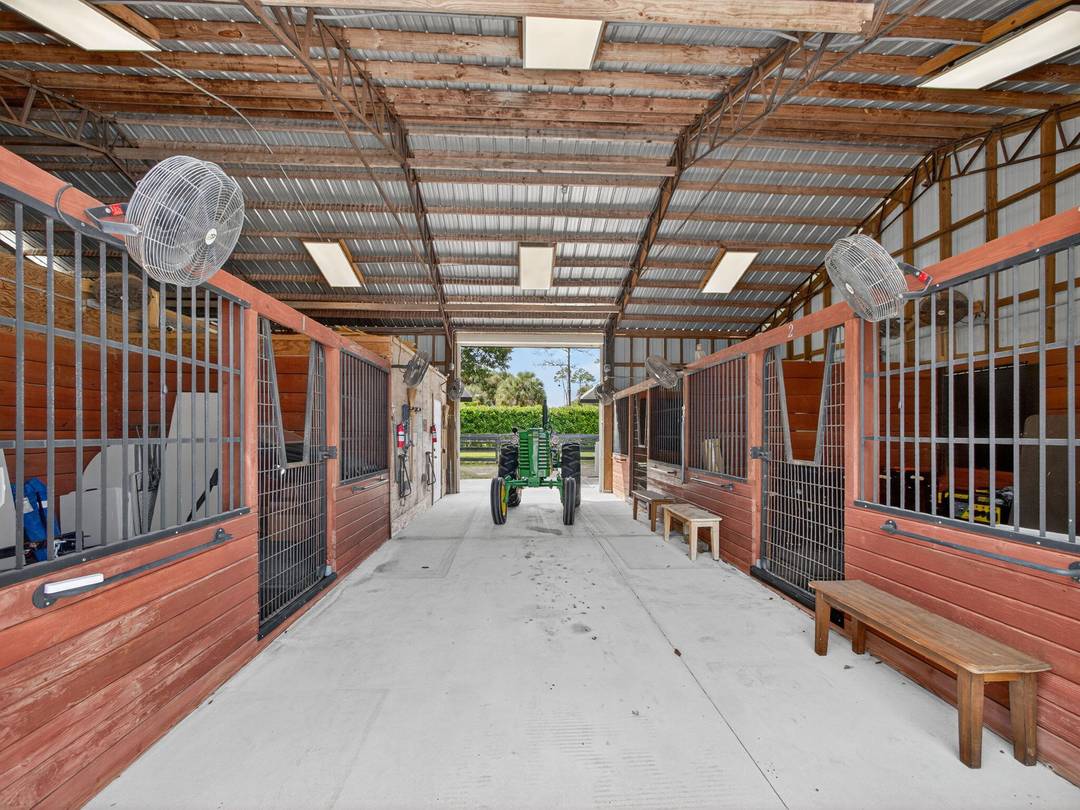 Welcome to a rare estate of distinction in the heart of Jupiter Farms 17593 Winterhawk Trail, a 5.