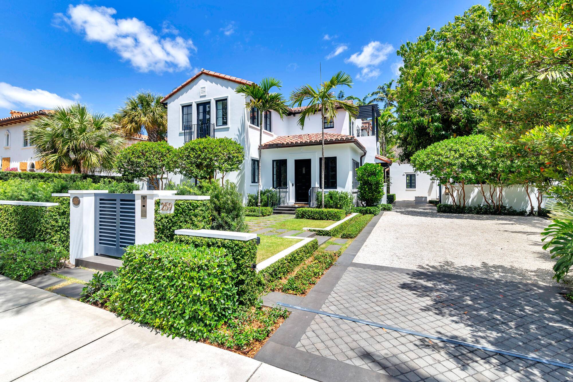 Tucked within the sought after El Cid neighborhood, this stunning, double gated 4 bedroom, 4.