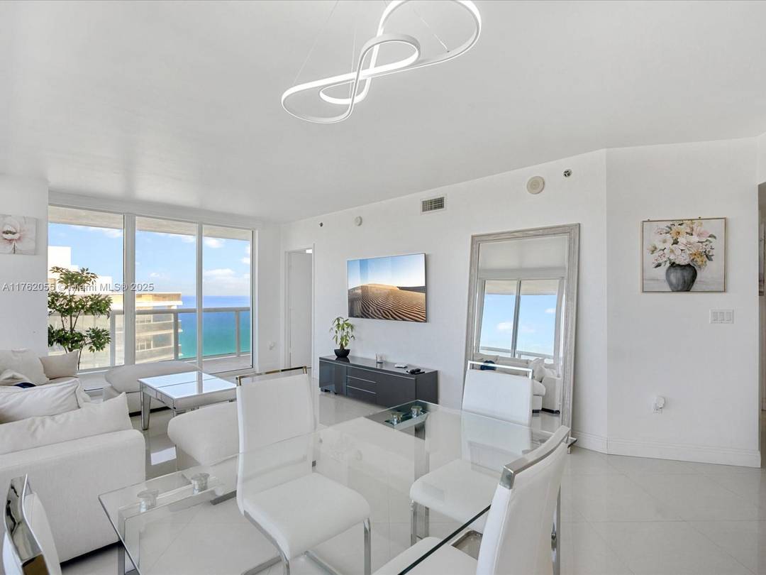 Enjoy breathtaking ocean, Intracoastal, and city views from this stunning 45th floor corner unit, featuring a wraparound balcony for panoramic vistas.