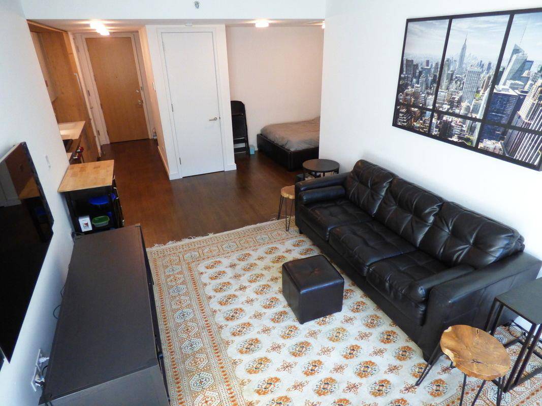Spacious sun filled Junior 1 bedroom apartment at the ultra contemporary The Jefferson condominium.