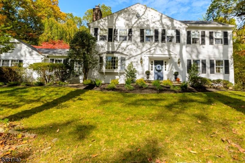 SUPER TRADITIONAL COLONIAL SET ON LARGE PRIVATE WOODED LOT OFFERS EH, LR, FDR, COUNTRY EIK W SLIDER LEADING TO PATIO IN GROUND POOL.