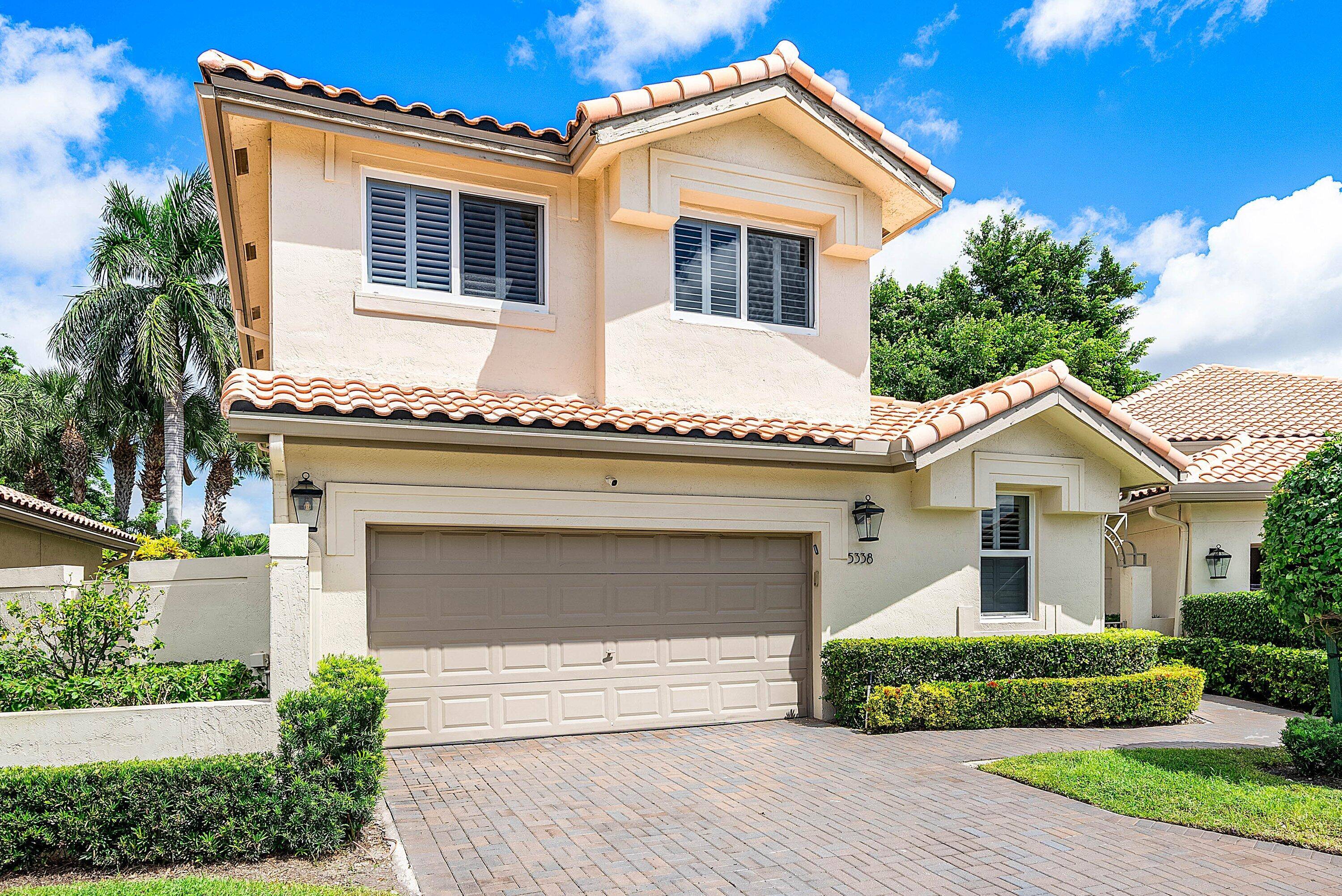 Welcome to this beautifully updated residence in the prestigious Broken Sound community.