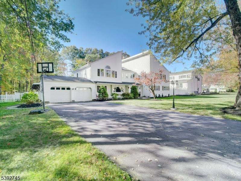 Privately nestled in Parsippany's sought after Druid Hill neighborhood, this stunning custom 6 bedroom home offers luxury, comfort, and effortless flow across a beautifully landscaped.