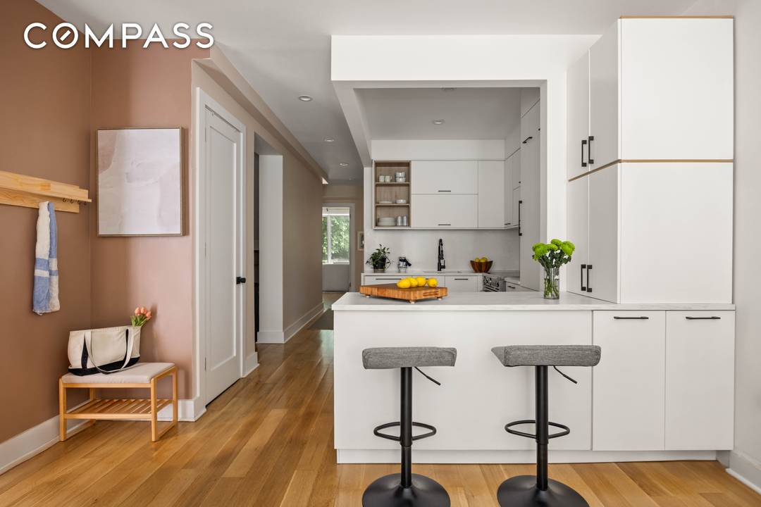 Bright, Elegant Garden Duplex with Private Backyard and Plentiful Storage This garden duplex offers warm, light filled living and dining spaces with charming bay windows and natural finishes throughout.