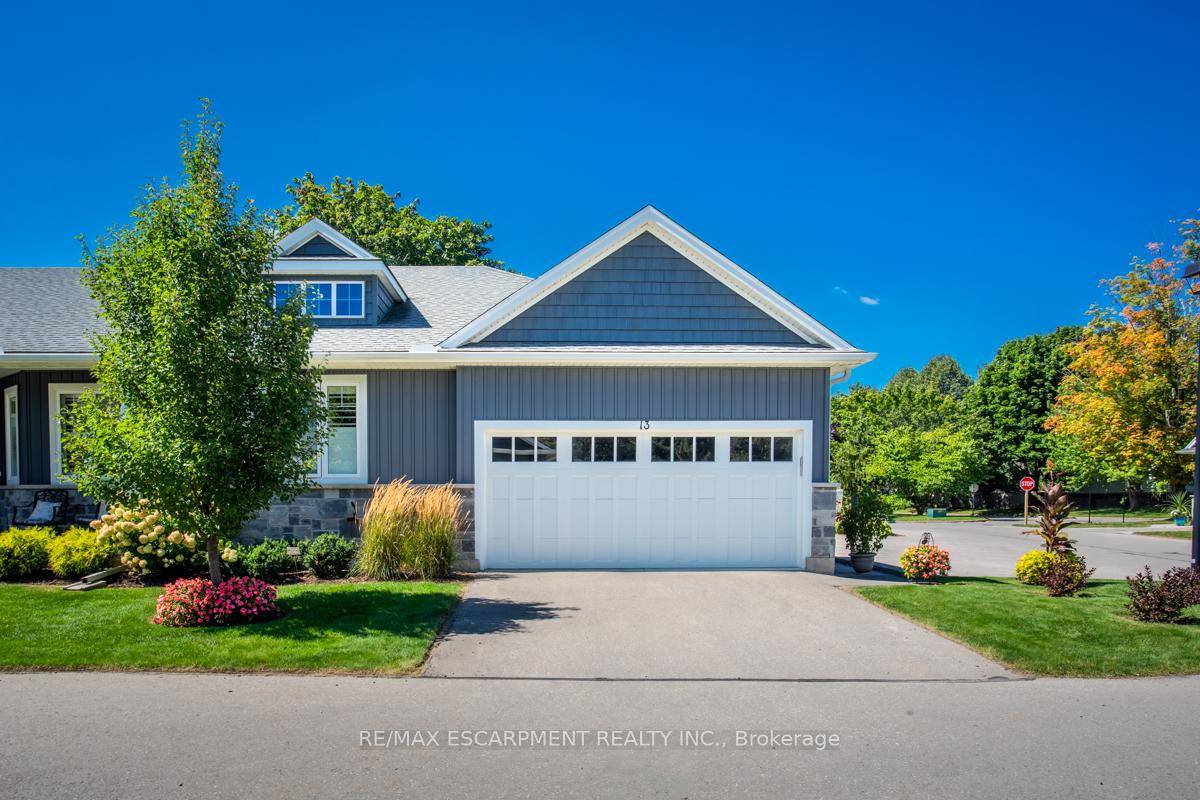 Look no further ! ! Gorgeous Bungalow End unit Town in small enclave of upscale towns.