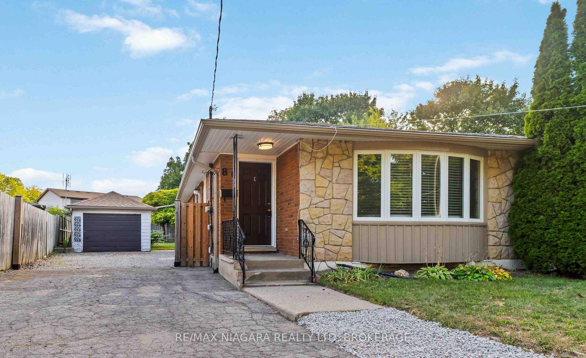 Welcome to this beautifully maintained 3 1 bedroom semi bungalow, perfectly situated with direct backyard access to St.
