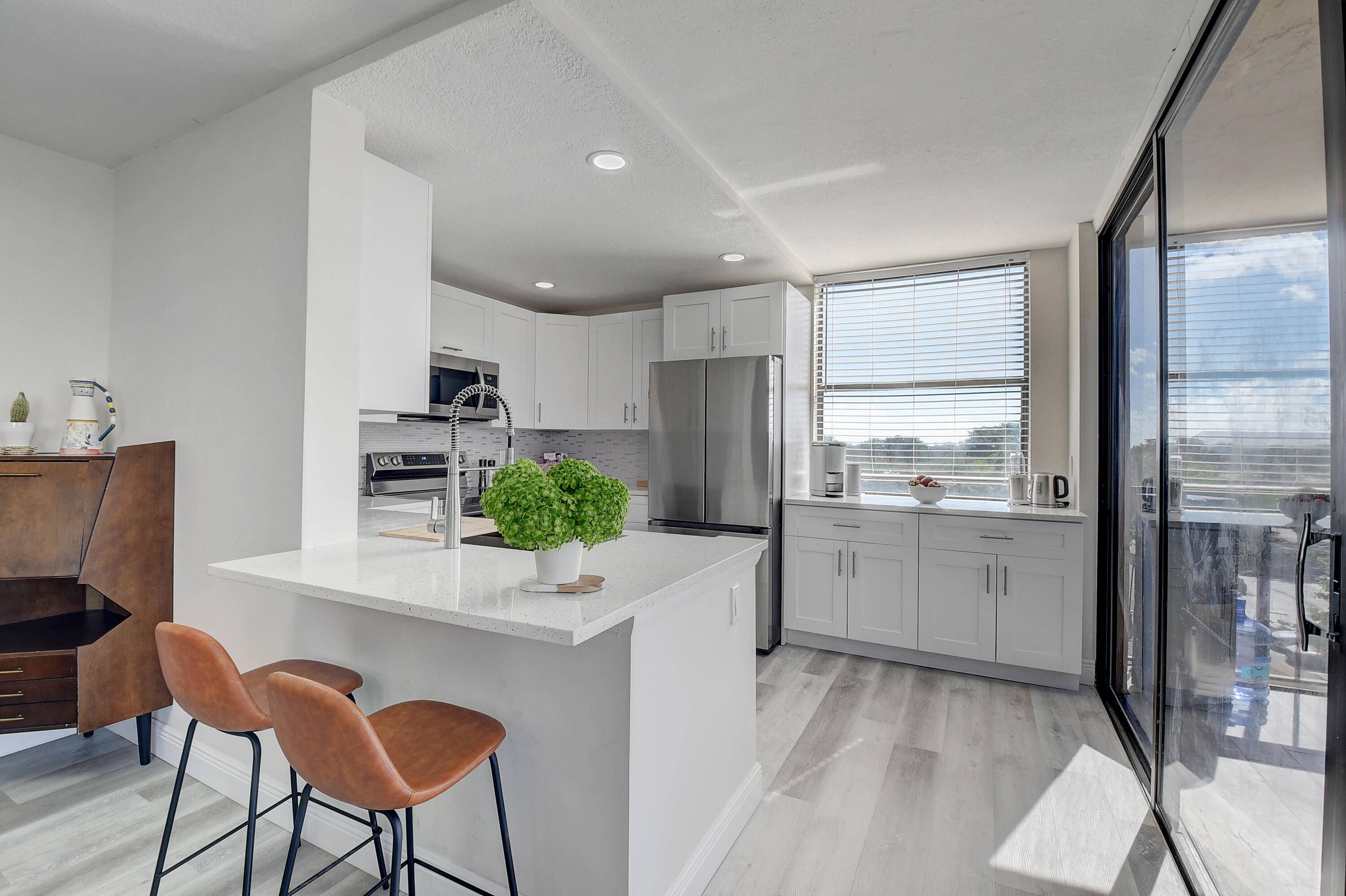 Beautiful Top unit facing West overlooking the pool tennis courts, completely renovated, with all attention to details.