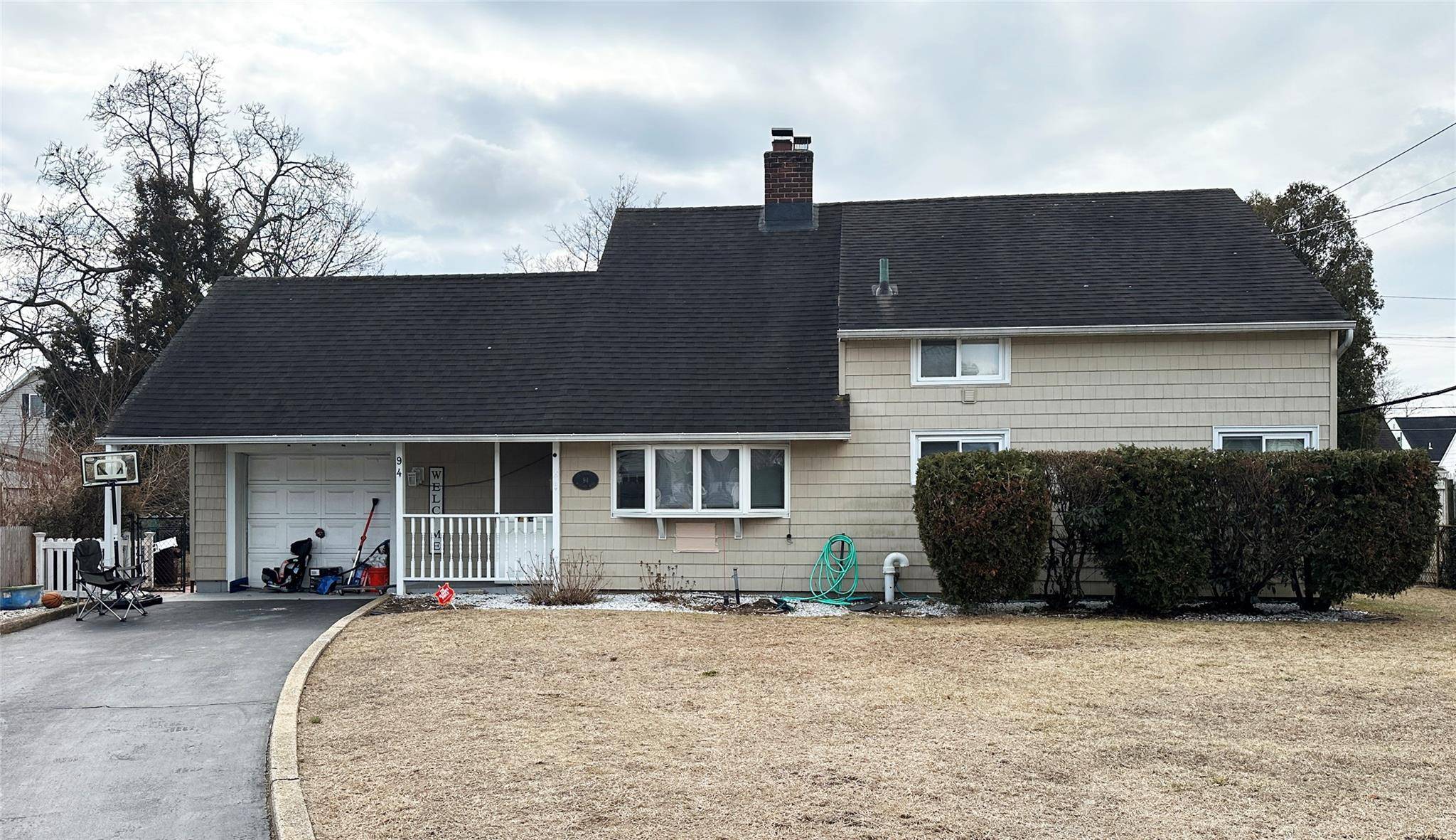 Rare one family cape in Levittown with a large 8349sf lot !