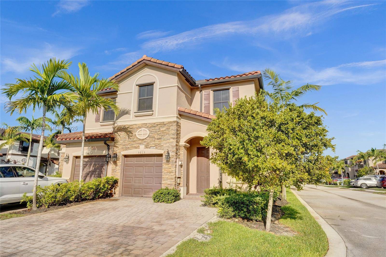 WELCOME TO THIS BEAUTIFUL CORNER TOWNHOUSE IN THE EXCLUSIVE AND TRANQUIL GATED COMMUNITY OF MAGNOLIA TRAILS !
