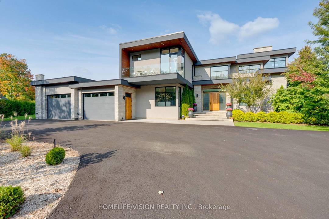 Experience luxury living at this breathtaking modern estate on 2 acres !