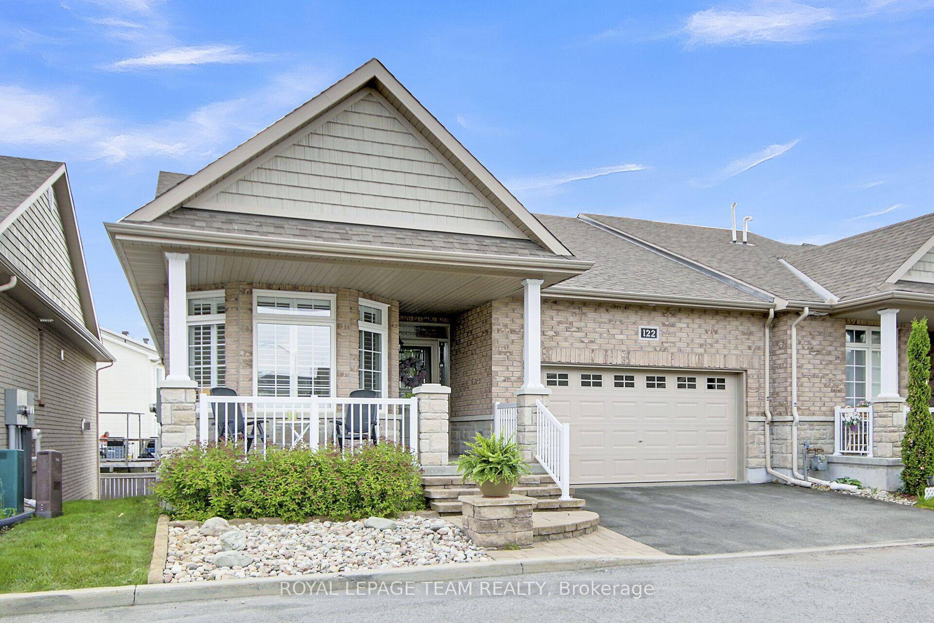Stunning end unit adult style bungalow, built in 2014, has a fantastic open plan amp ; walkout lower level.