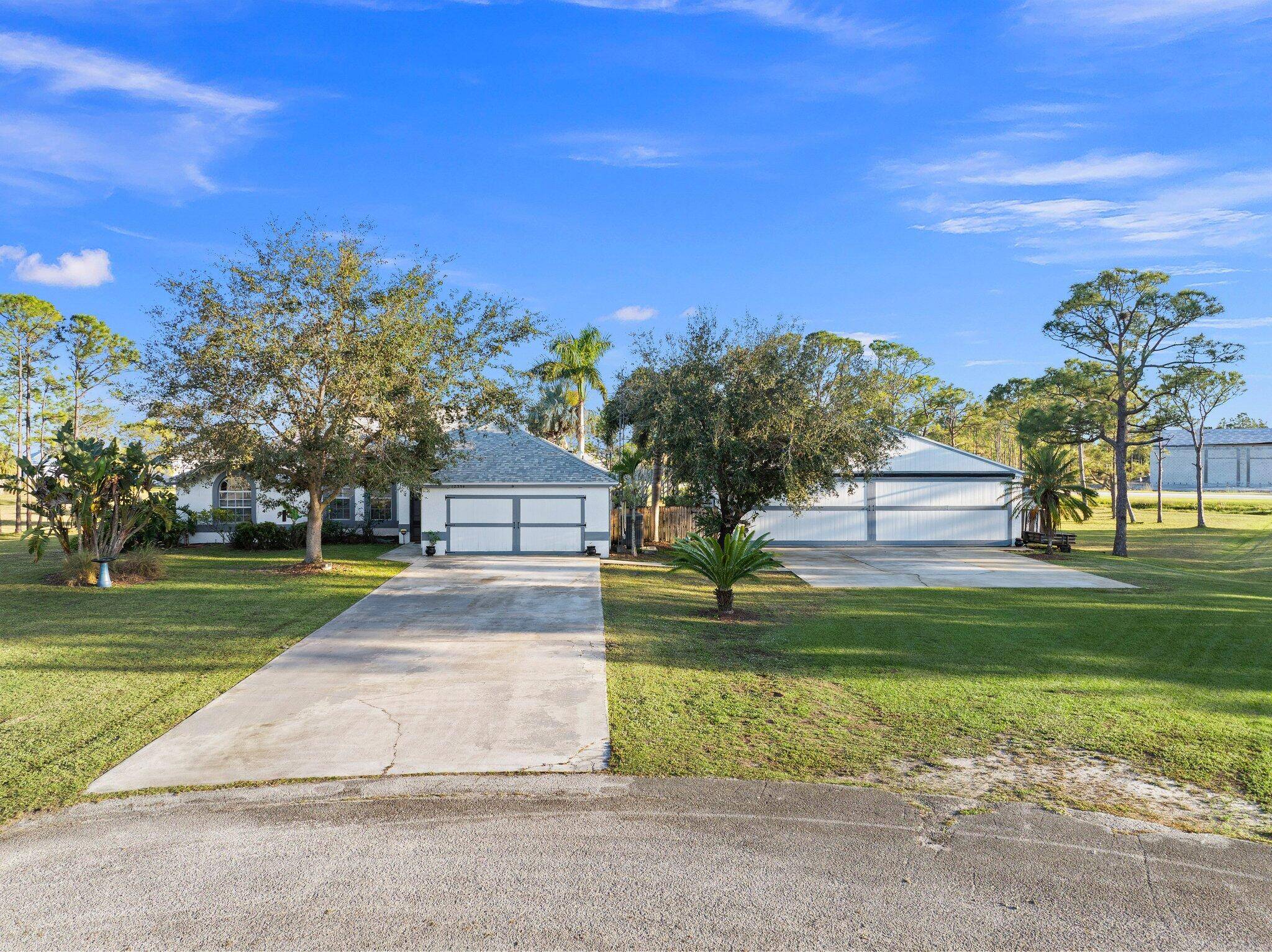 Discover this exceptional 3 bedroom, 2 bathroom custom built home situated on 2.