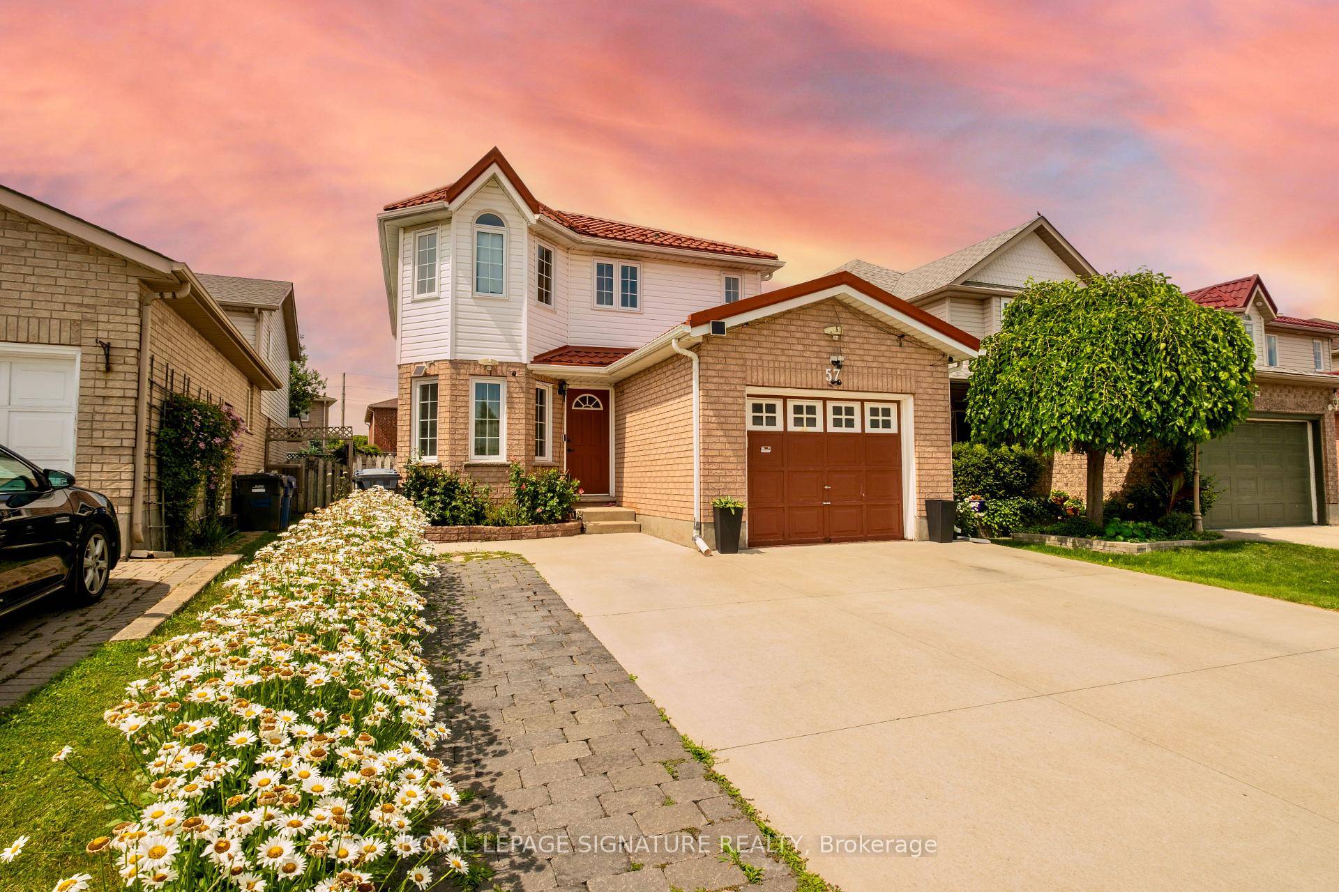 Welcome to 57 Ryde Road a sun filled, fully upgraded 4 bedroom, 4 bathroom detached home on a perfectly level, fenced lot in the heart of Guelph.