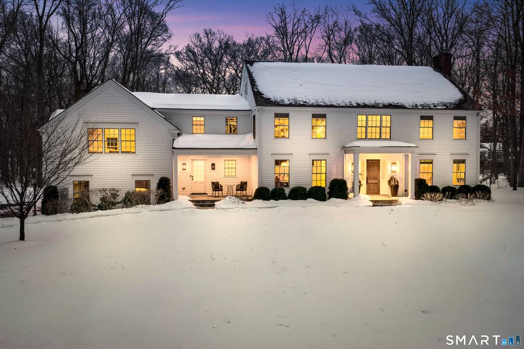 Ideally situated between the coveted town centers of Darien and New Canaan, this exceptionally and recently completely redesigned colonial rests on 2.