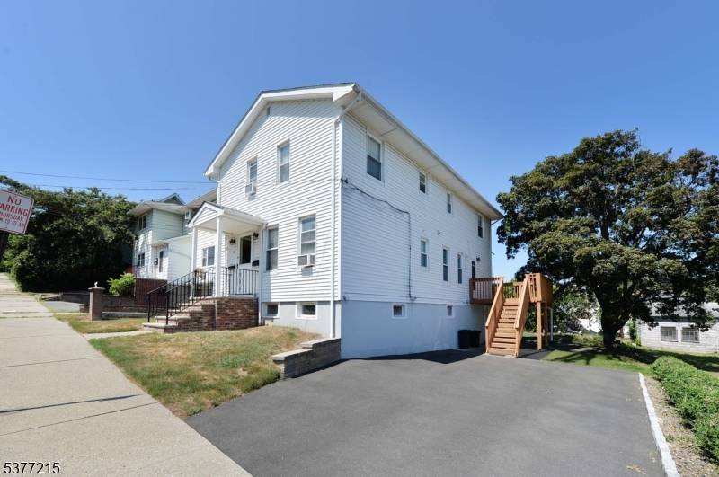 Pride Of Ownership Abounds In This Well Maintained Two Family.