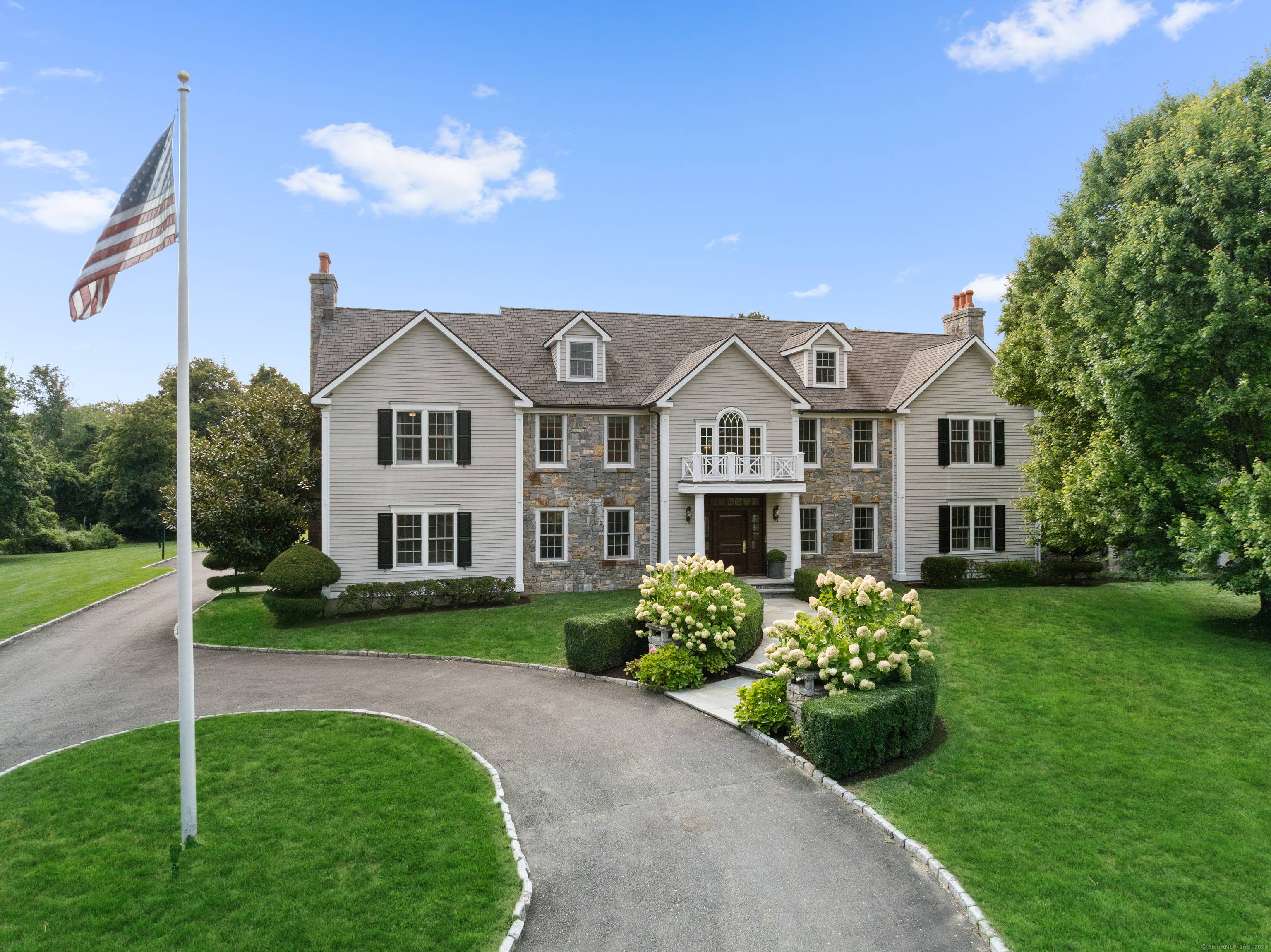 Expanded and fully renovated in 2005, this exceptional Colonial is located in the prestigious Hoyt Farm neighborhood, close to the village.