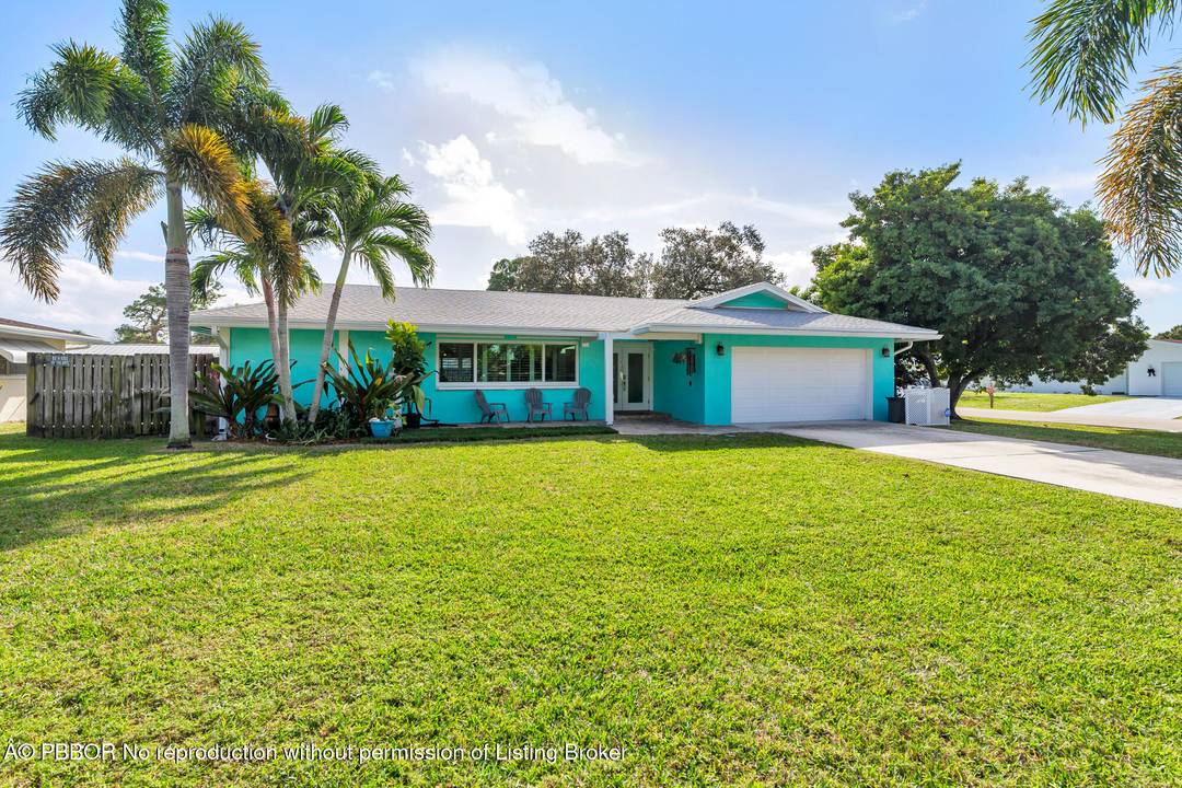 Situated on a quiet street within a highly desirable non HOA neighborhood, this corner lot, single family home sits in the heart of Palm Beach Gardens.