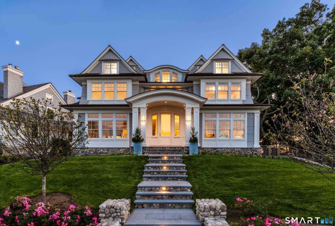 Set prominently along the coveted shoreline of Rowayton, this extraordinary residence is a true architectural masterpiece that defies the standard coastal trope.