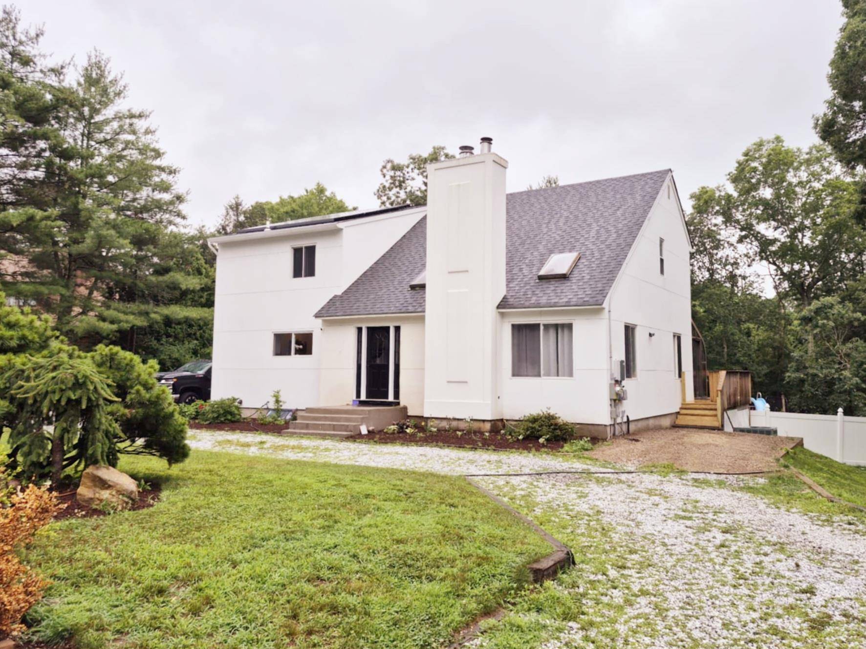 Welcome to 14 Caputo Drive in Manorville, NY, a beautifully remodeled contemporary home that s truly move in ready and simply stunning.