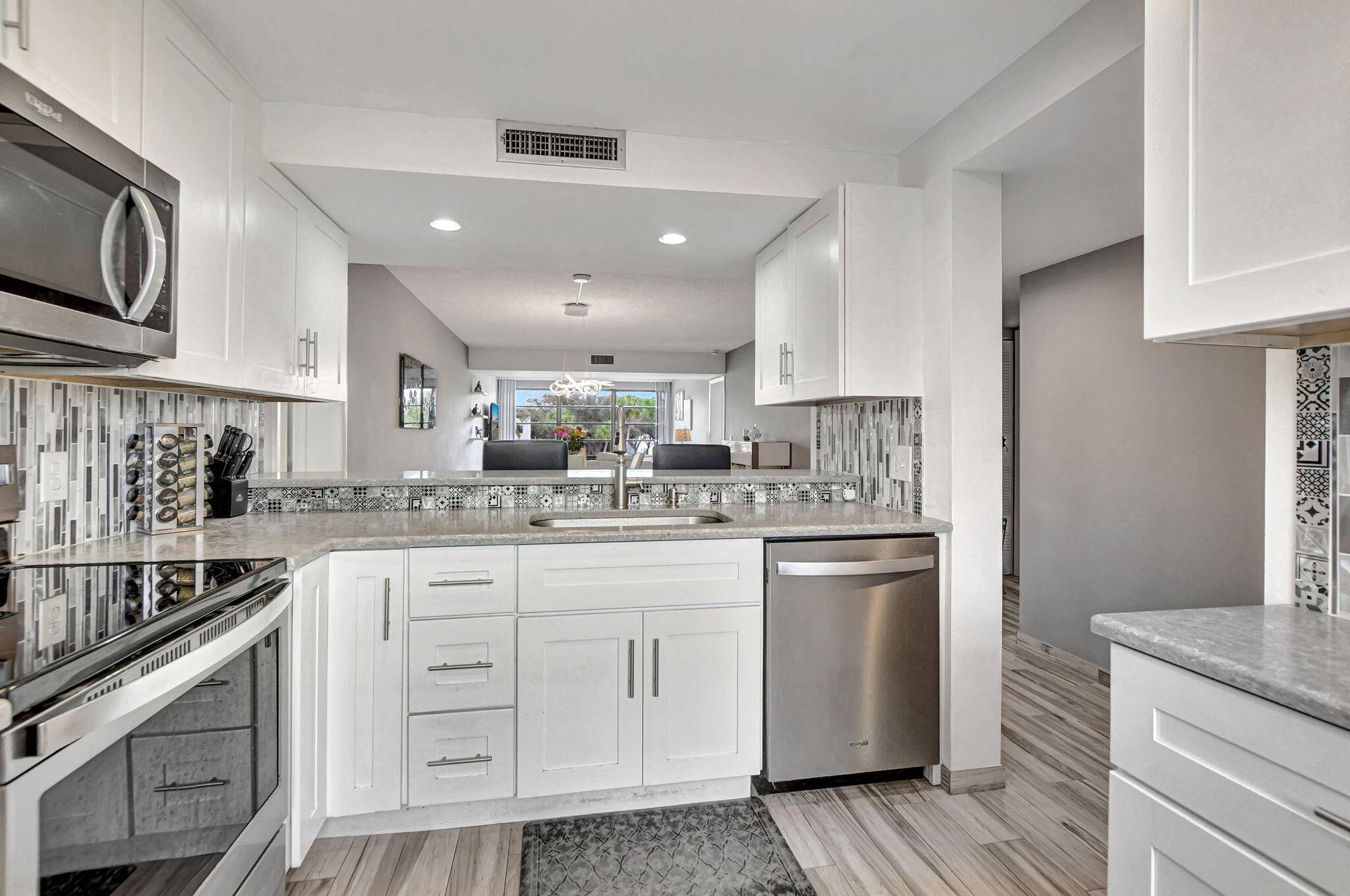 Welcome to your exquisite lakeside retreat in the heart of Central Boca Raton, where luxury meets tranquility !