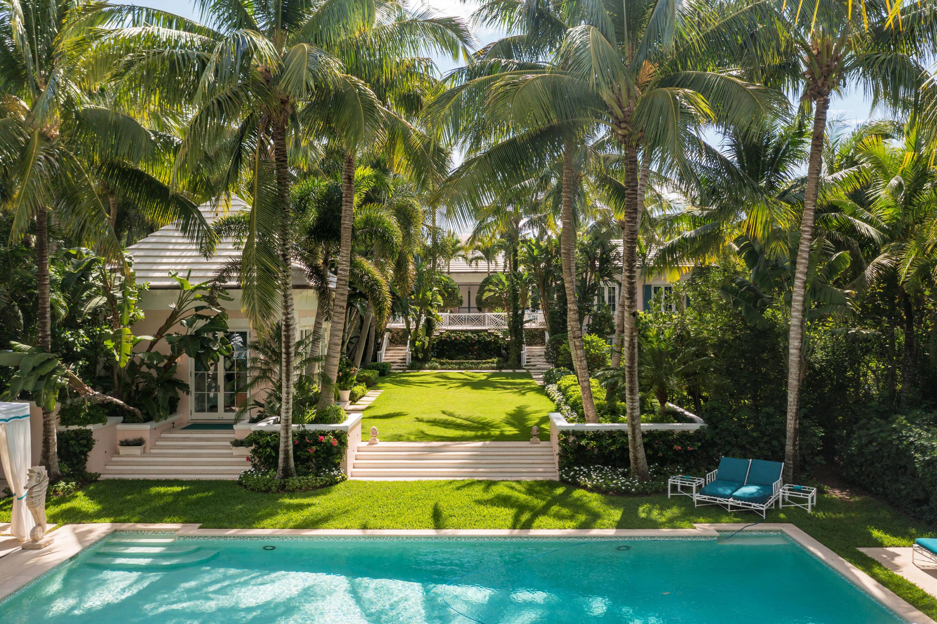 Sitting on 2 acres with a direct oceanfront parcel, 338 S Beach Rd on Jupiter Island is the epitome of old world Florida sophistication and tasteful elegance.