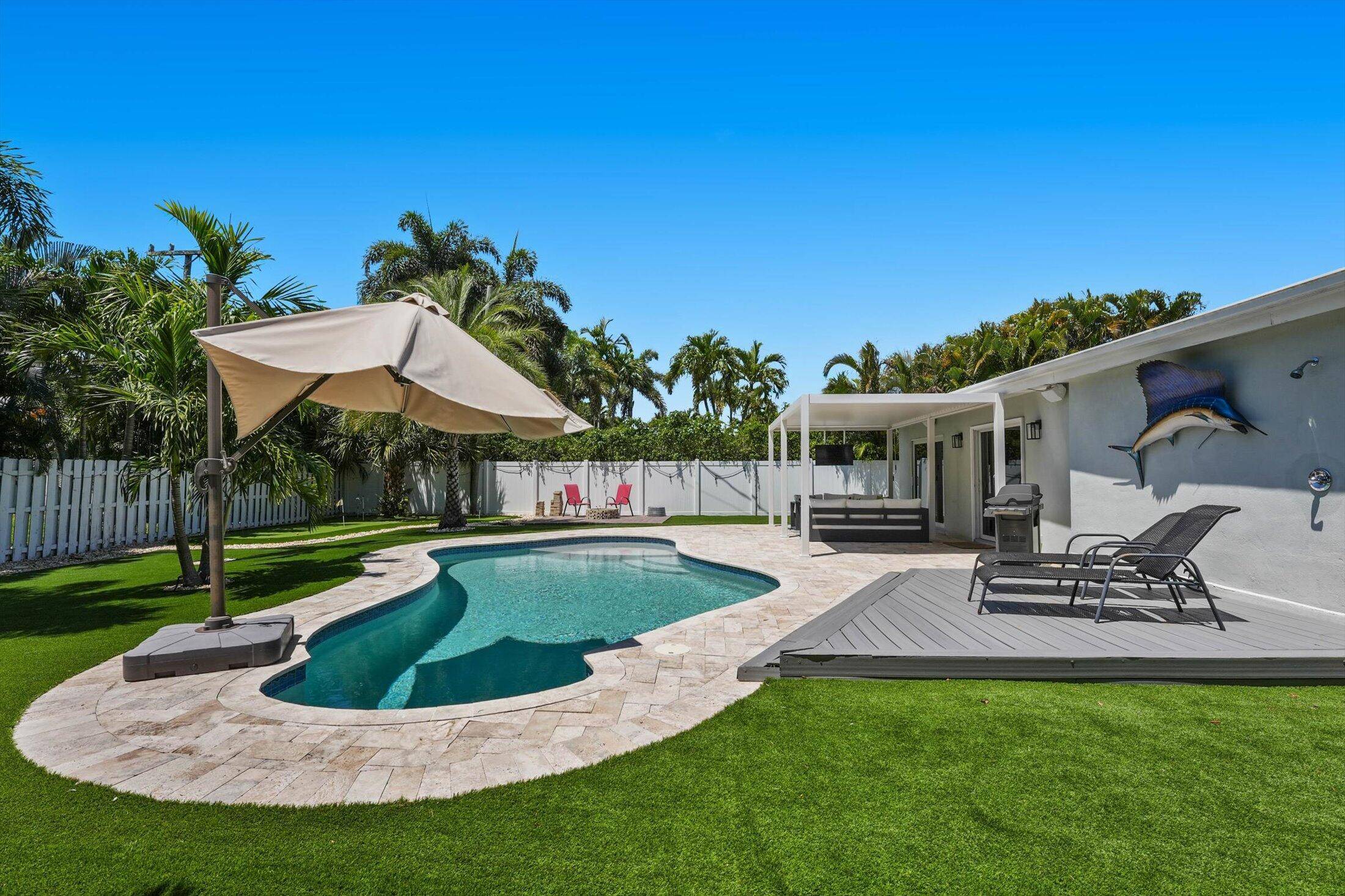 This inviting and updated 3BR 3BA pool home in desirable Palm Beach Farms offers the perfect blend of comfort, functionality, and style.