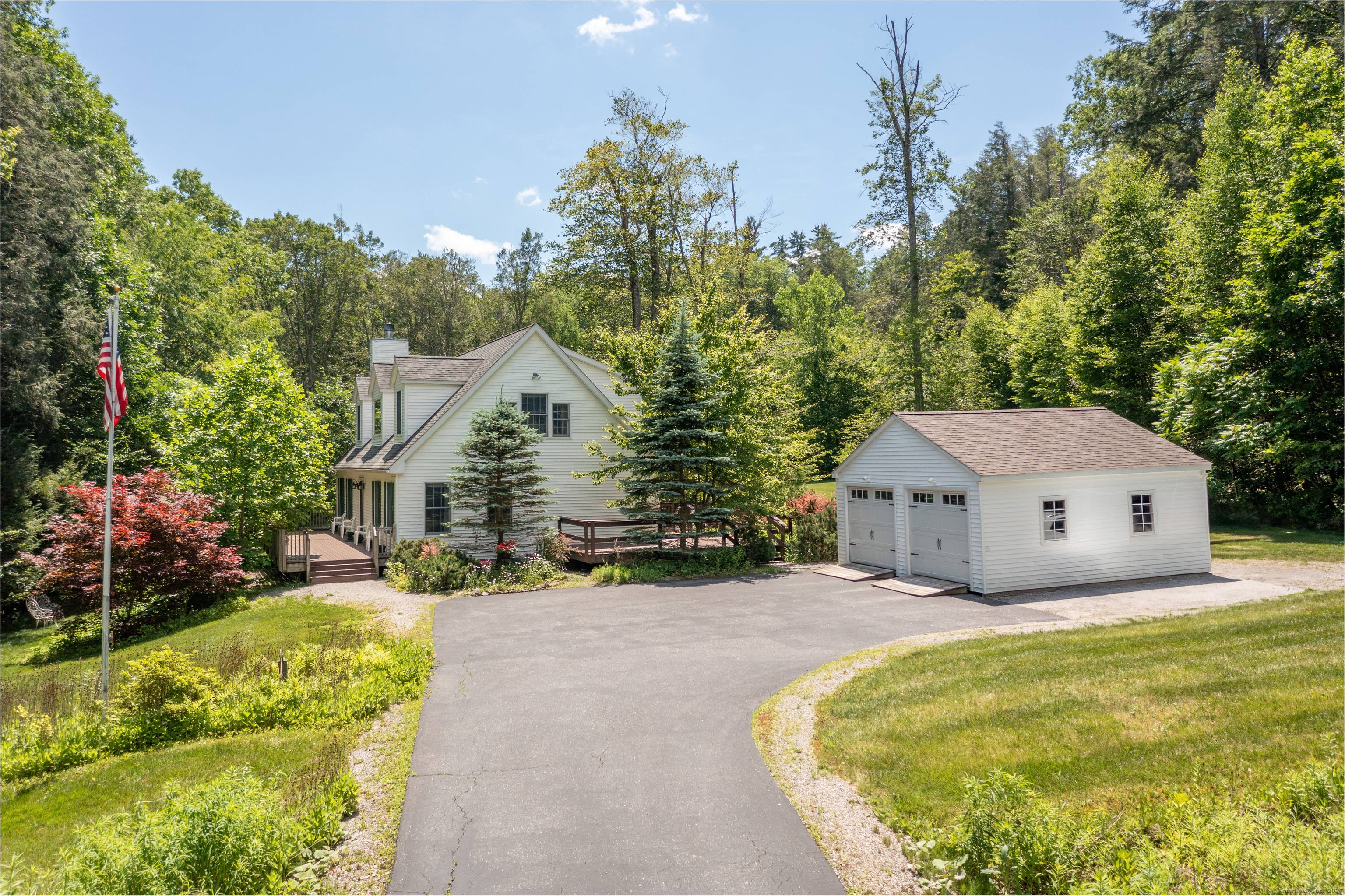 Set on a stunning, open lot with fields, wildflowers, stone walls, and a babbling brook, this oversized Cape offers the perfect blend of cozy living and scenic surroundings.