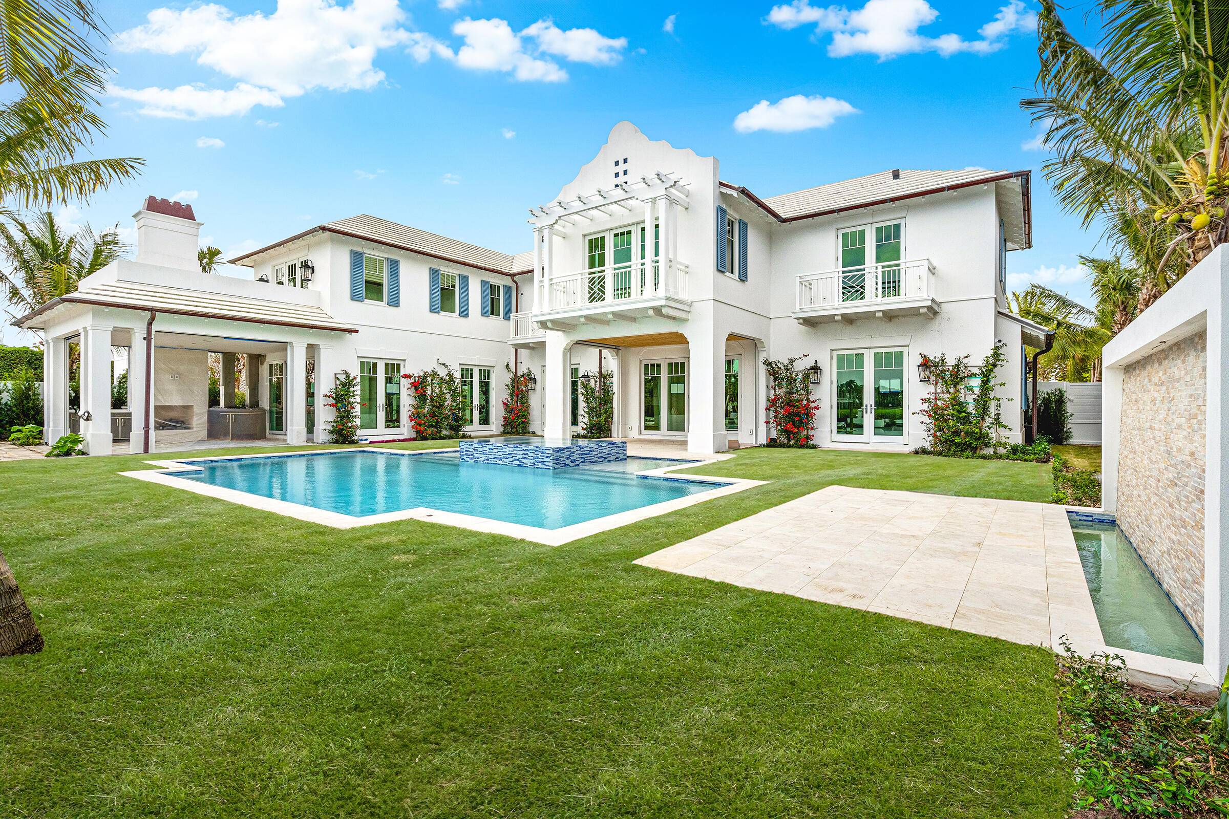 Welcome to 584 Island Drive, the premier newly built home available on Everglades Island in Palm Beach.