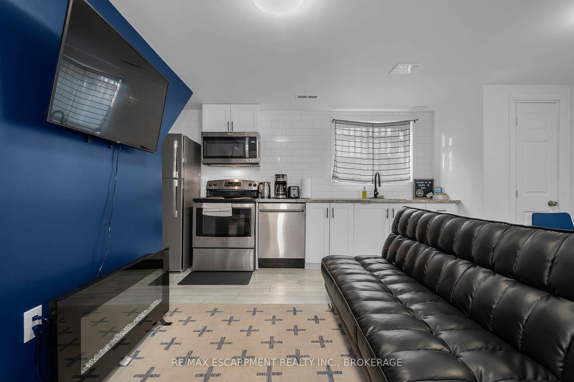 This updated 1 bedroom, 1 bathroom lower unit offers a bright and functional layout with the convenience of in unit laundry.
