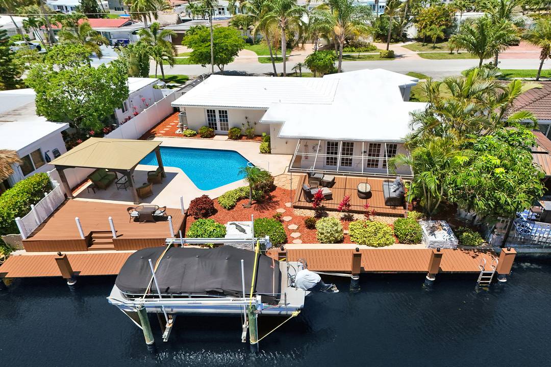 Ocean Access ! ! Turnkey Beautifully 3 2 with marble flooring throughout, Waterfront Home in East Pompano Beach.