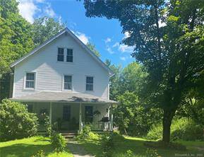 TUCKAWAY is a spacious two family home tucked away at the end of a quiet dead end street in historic Norfolk Connecticut.